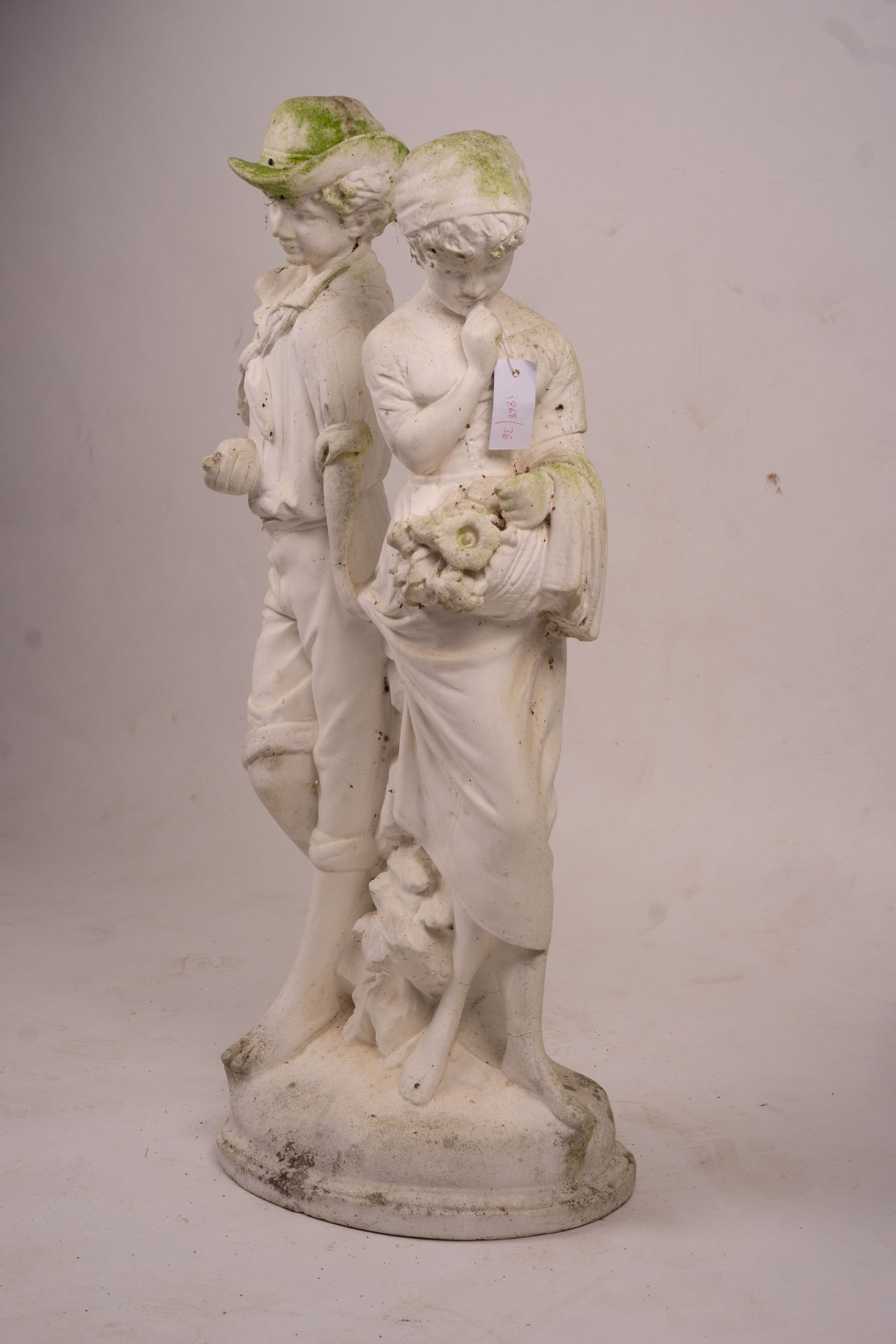 A reconstituted stone garden ornament of fruit and flower pickers, height 89cm